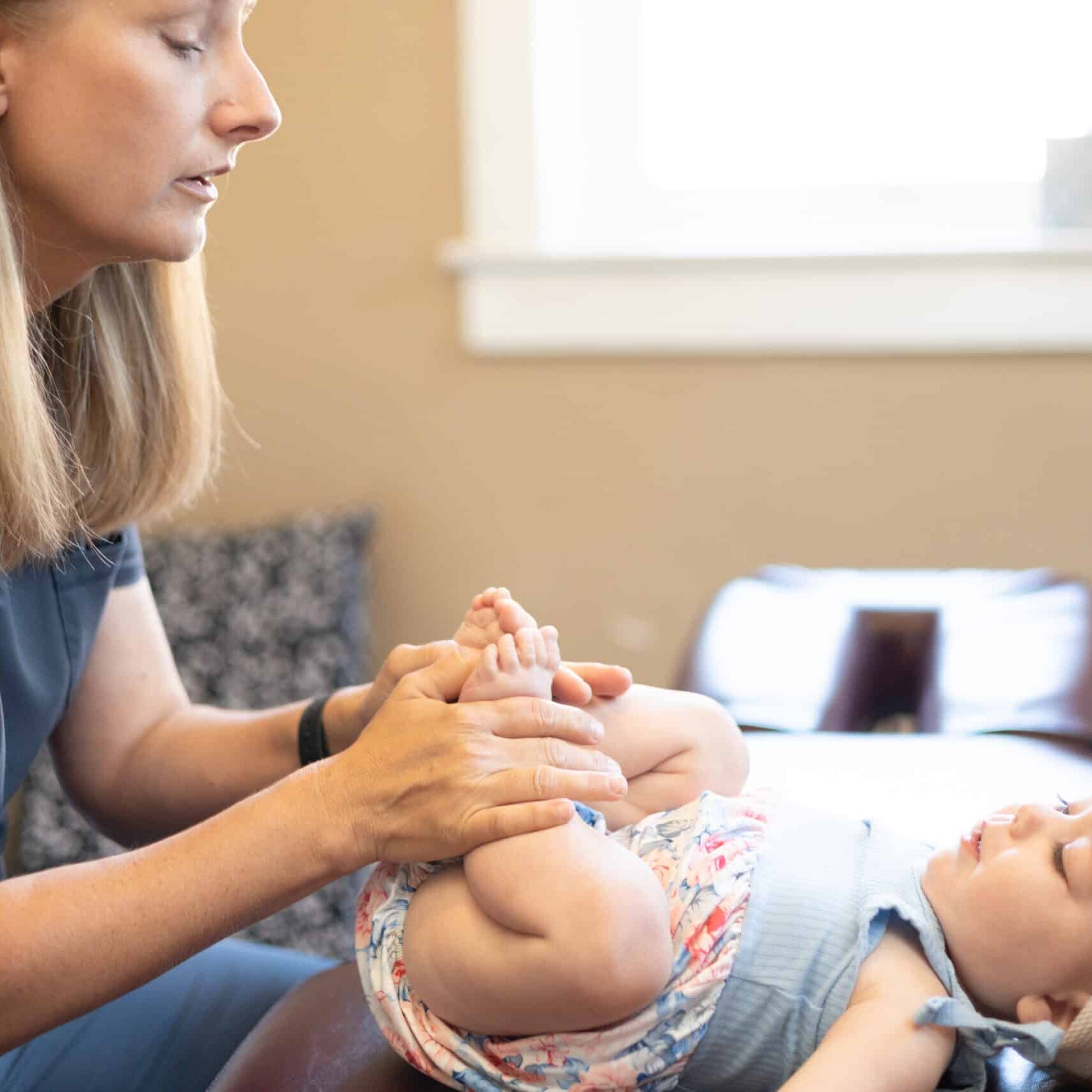 Dr. Colleen working with a pediatric patient.